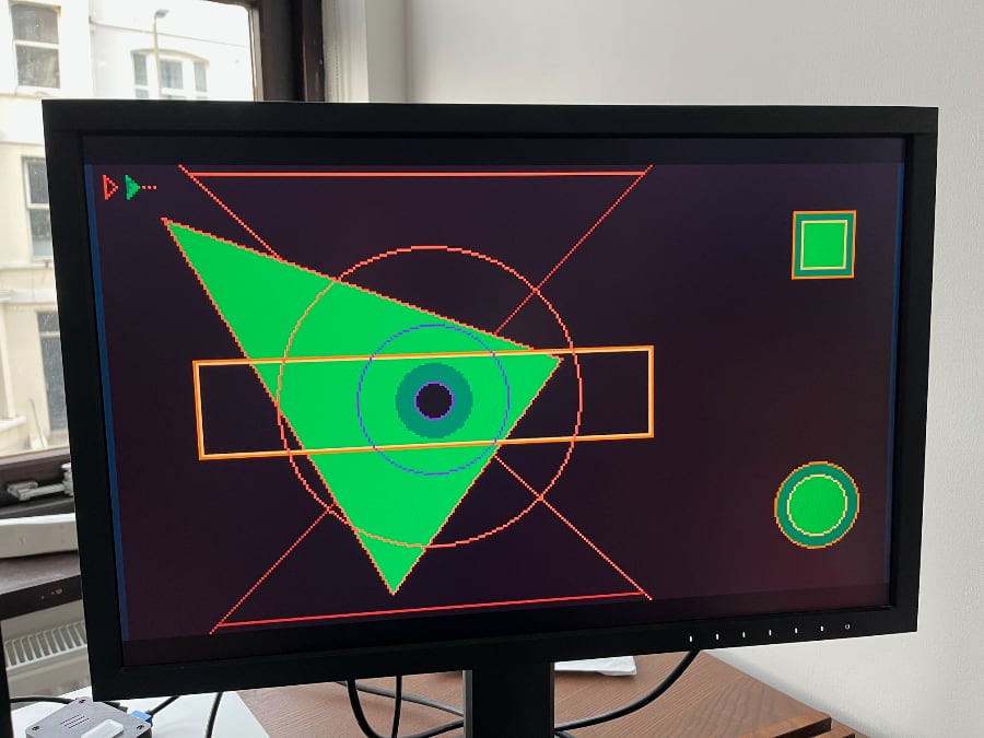 Monitor attached to FPGA dev board (out of shot) displaying Earthrise all shapes test.