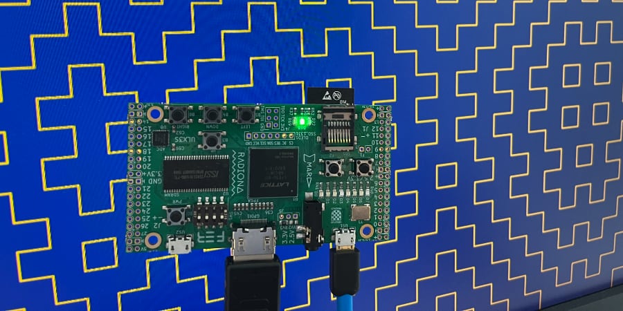 Monitor connected to ULX3S dev board via HDMI cable showing hitomezashi pattern.